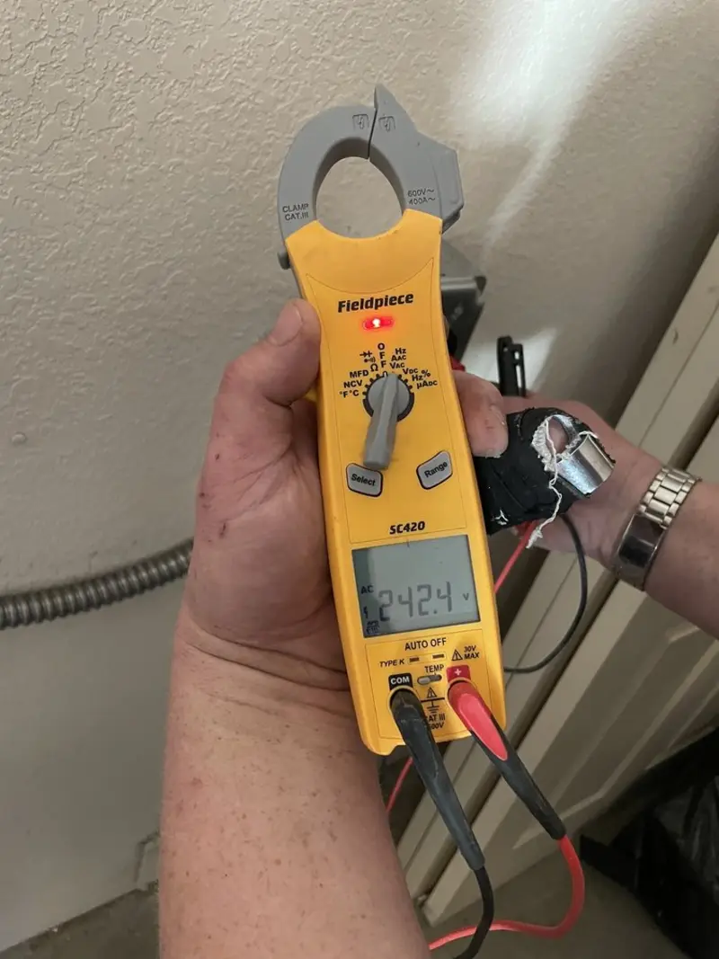 Voltage testing with clamp meter during Ceiling Fan Installation in Brewton